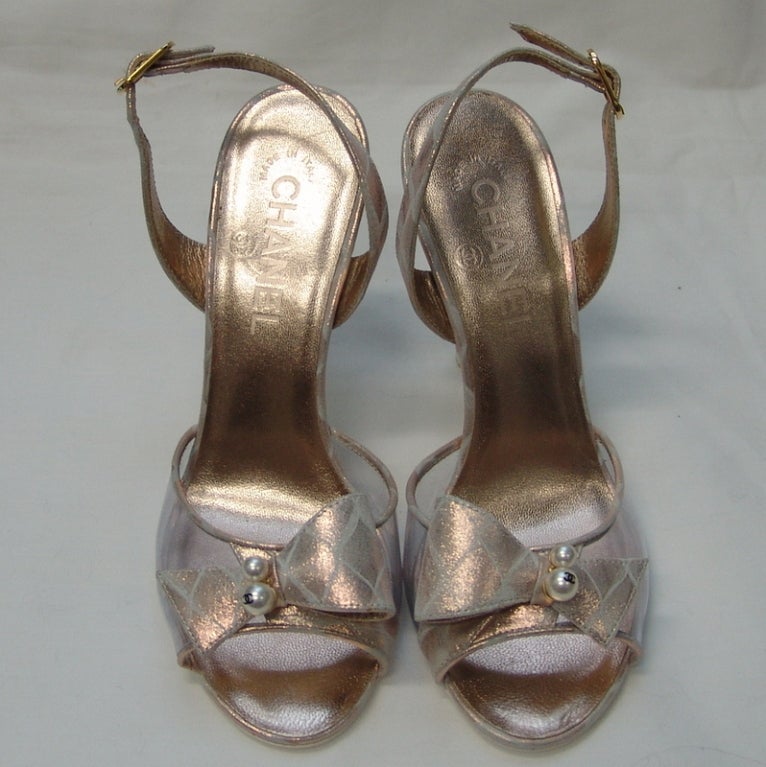 Chanel metallic with clear front, never been worn.  Heel 4