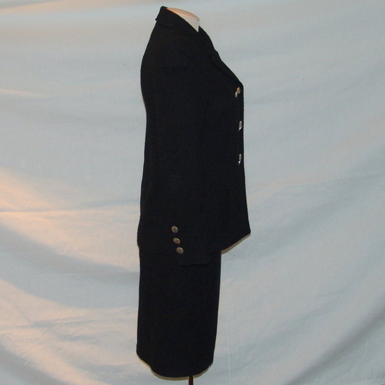Chanel black wool suit. Jacket - length 25