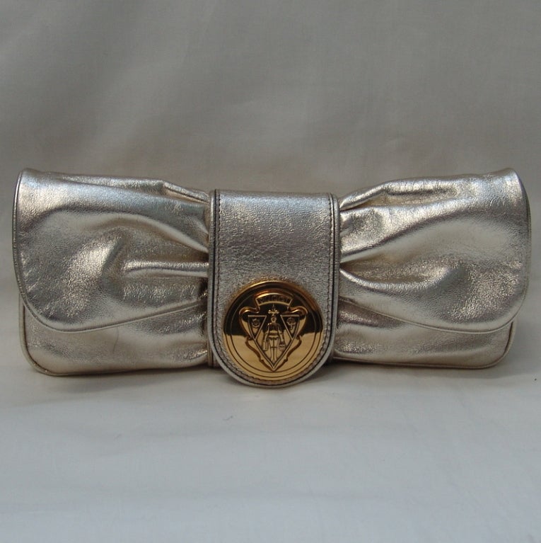 Gucci gold metallic handbag or clutch.  Height 4