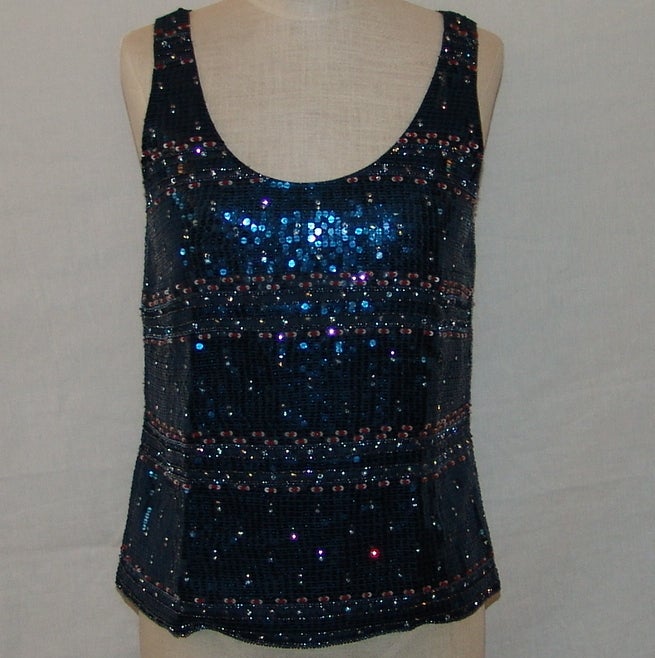 Giorgio Armani navy blue, red and clear sequin and beaded top. This beautiful top is in excellent condition.
Measurements:
 length 22
