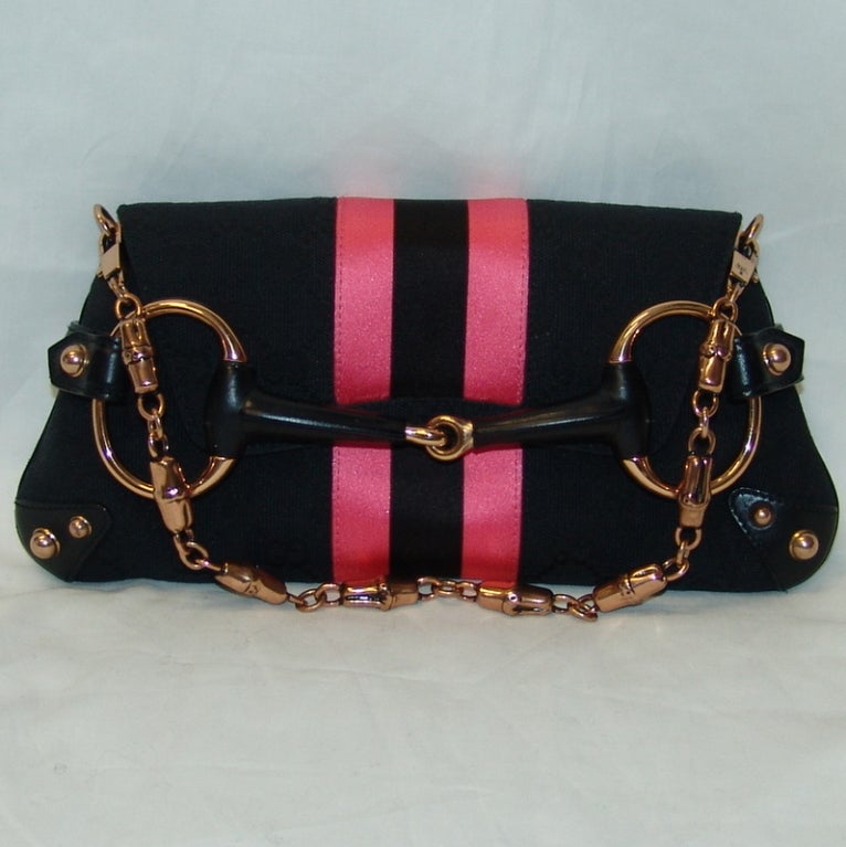 Gucci black canvas logo handbag with pink ribbon.  Height 5