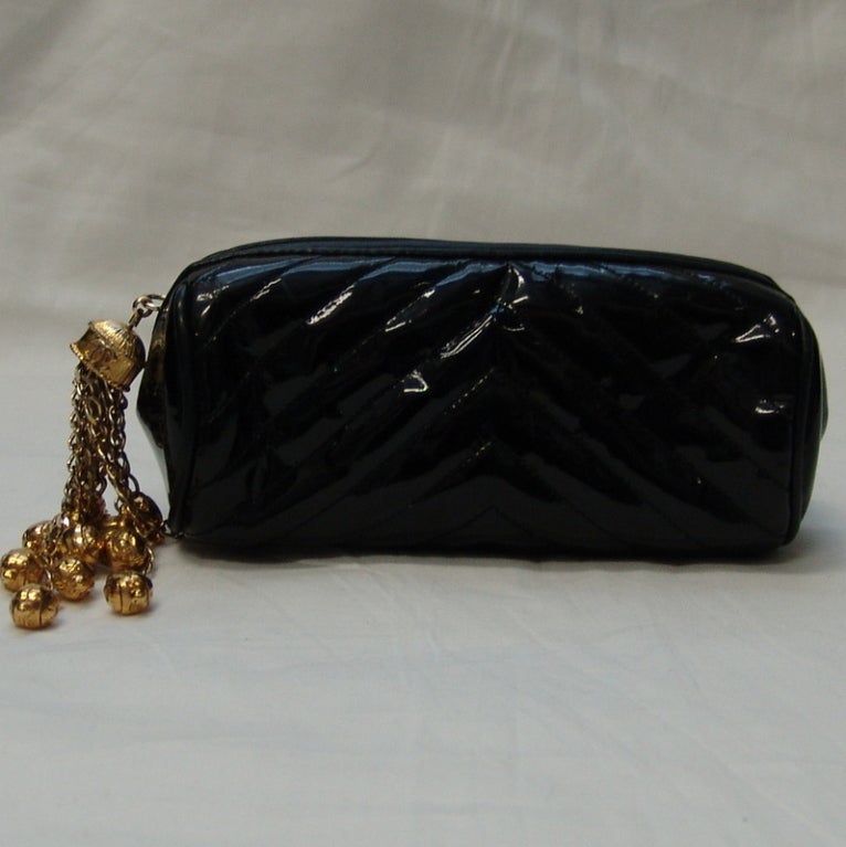 Chanel black, patent leather cosmetic bag.  Height 3