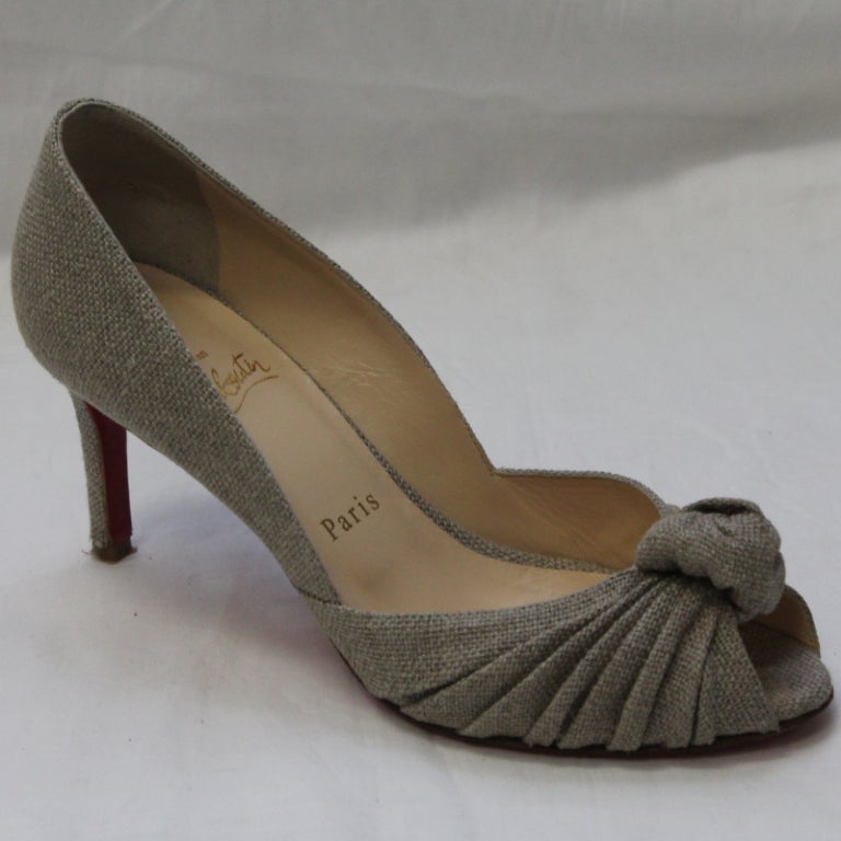 Louboutin taupe woven shoes with flower detail and 3