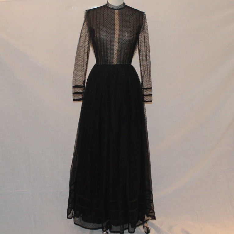 Pauline Trigere Black Point d'esprit Gown - size 10 - Circa 70's This beautiful gown has layers of tulle and lace, and is pure elegance. It is in excellent vintage condition. 
Measurements are:
Bust : 36"
Waist : 30"
Length : 60"