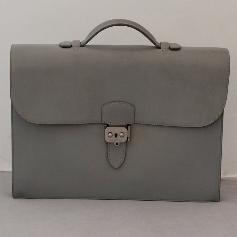 Hermes Light Grey Kidskin 35 cm Sac a Depeche- SHW-2001 Very rare color. Briefcase comes with Duster and box. Clochette and keys are not available. Excellent pre-owned condition.