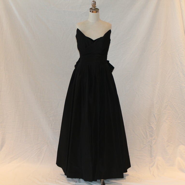 Vintage Chanel Black Taffeta Strapless Gown, Velvet detail at top of bustier, full skirt and crinoline/silk petticoat, beautiful bow in back - Circa 70's - vintage size 12.