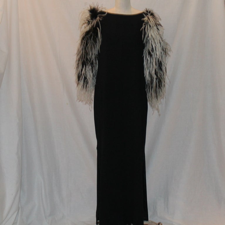 Richilene Black Silk Gown w/ Blk & Wht Ostrich feather sleeves. What a statement dresss. The measurements are as follows:
Bust 40
hips 42
Sleeve length 20
length 56