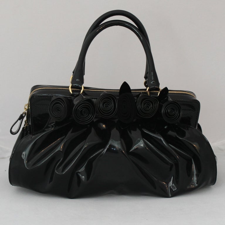 Beautifully Feminine Valentino Black Patent Leather Fleur Handbag
Measurements:
Height 7