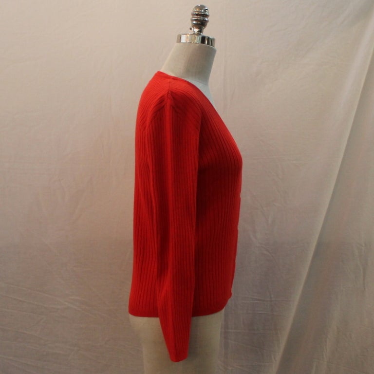 Vintage Courreges Red Cardigan V Neck Sweater - Small - Circa 80's. Item in excellent condition. White buttons down front.
Measurements:
