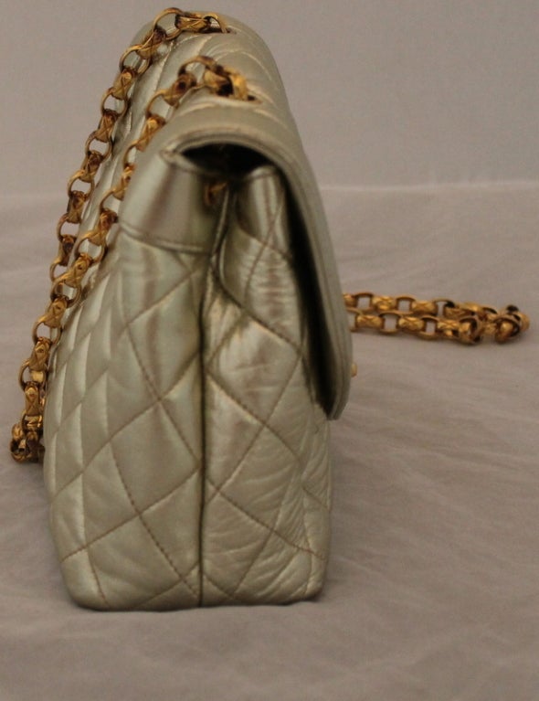 Chanel Vintage Gold Lambskin Quilted Mini Flap Handbag - 
circa 1989. This vintage bag is in excellent condition.
The measurements are:
Bottom length 8