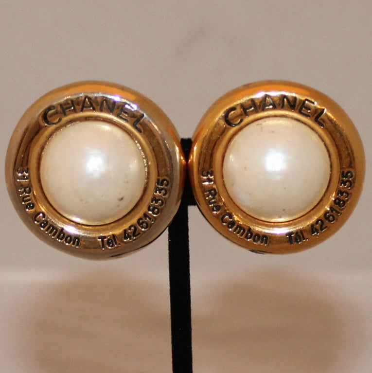 Chanel Vintage Gold and Pearl Rue Cambon Earrings - Circa 60's 
These earrings are in good condition. Some wear to the pearl and the gold finish.