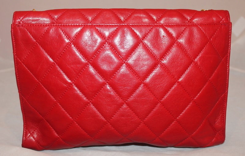 Chanel Vintage Red Lambskin Single Flap Shoulder Bag- GHW-Circa 70's This beautiful vintage bag is in excellent condition. It has one exterior pocket and 1 interior zip in the main compartment. Has the classic CC closure. This is a true collectors