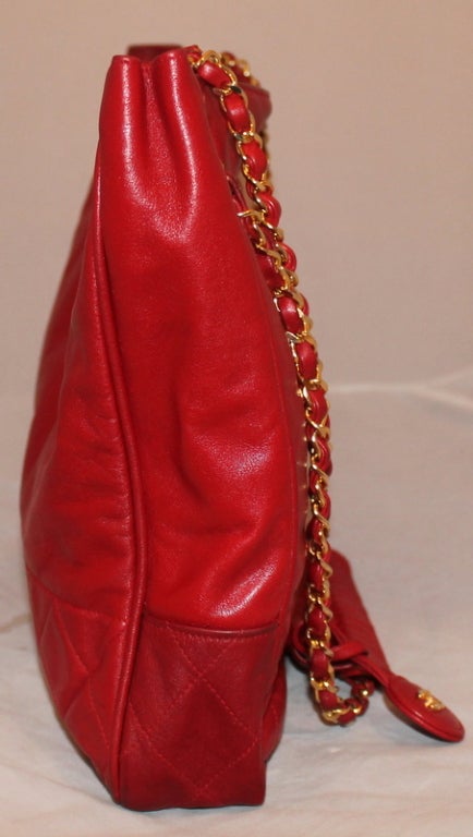 Chanel Vintage Red Lambskin Tote - GHW - Circa 70's This bag is in very good condition and just needs a little TLC. The red on it is  perferection. This is a VERY RARE FIND...Would be a wonerdful addition to anyones chanel collection.
Measurements