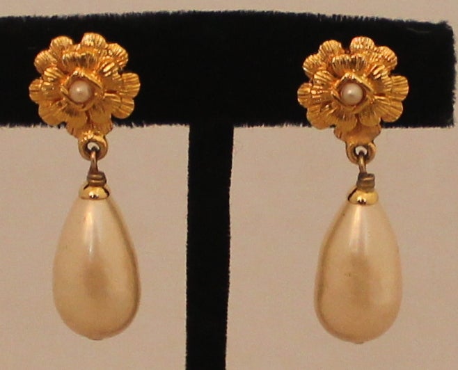 Chanel Vintage Pearl Drop Earrings - Circa 1994  Goldtone Floral Clip on with center pearl and hanging pearl. Length 1.5