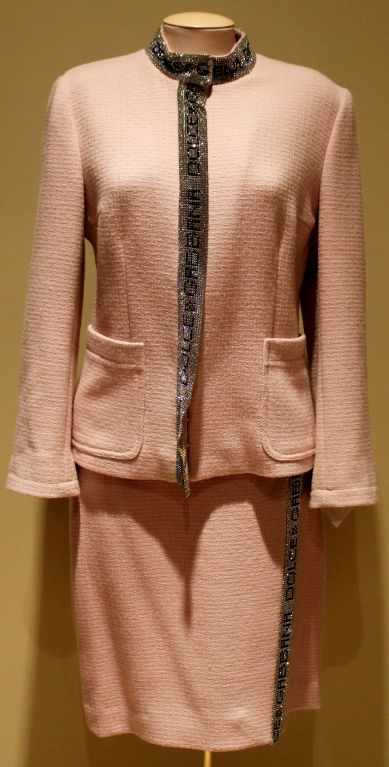 Fabulous Dolce and Gabanna Pink Tweed skirt suit with Rhinestone detail trim along neckline and down the front of the suit. Size 8<br />
Additional Measurements: Shoulder to Shoulder: 15
