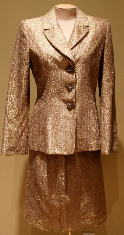 Badgley Mischka Bronze Lace Skirt Suit - Size 6 This beautiful skirt suit has fabulous buttons and is from the 90’s.  
Measurements:
Shoulder to Shoulder: 17