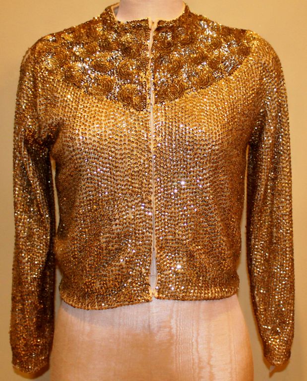 Vintage Saks Fifth Avenue Gold Sequin Cashmere Cardigan. Size 6. Circa 60's<br />
<br />
Additional Measurements:<br />
Shoulder to Shoulder : 14 1/2