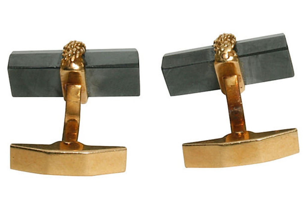 Tiffany & Co. Hematite and 18 Karat Gold Baton Cufflinks, the bars wrapped in twisted 18kt gold. With toggle backs. Stamped 