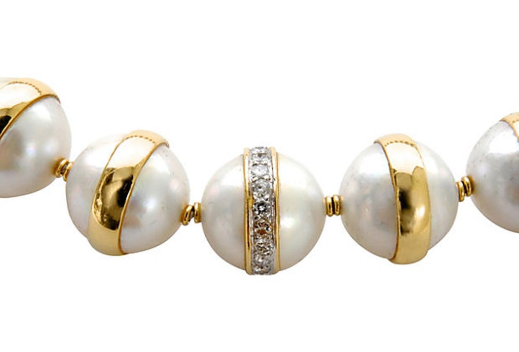 Mabe pearl and gold planet chocker. Each 