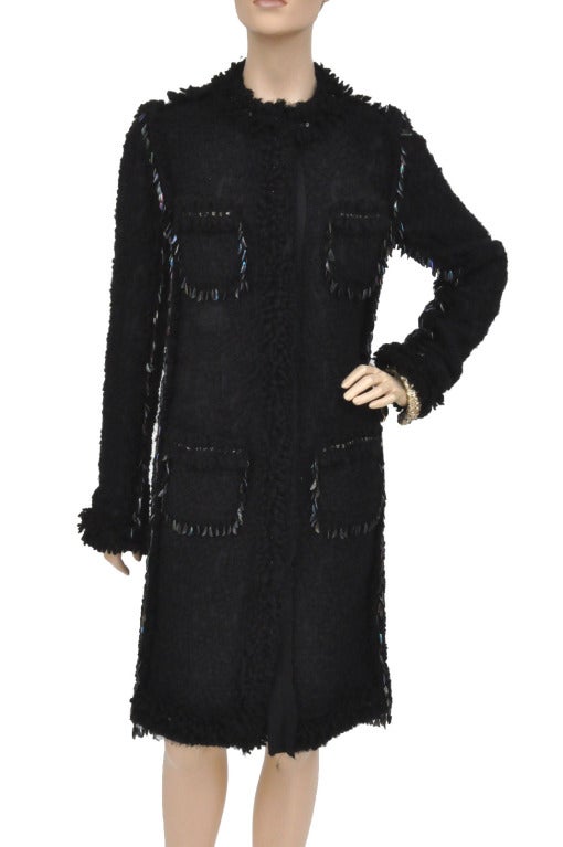 LANVIN

Cut a super chic silhouette in Lanvin's sophisticated bouclé-tweed coat. 

Detailed with intricate metal brass embellishment and embroidery.

Metal embellished, round neck, long sleeves, patch pockets, raw edge trim, fully lined.