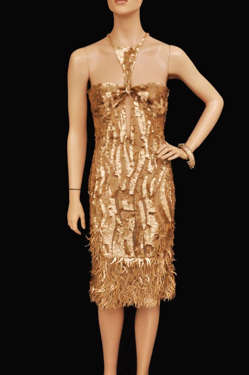 2004 Gucci collection
Designed by Tom Ford
Unique, Rare and Highly Collectible!  

Mischa Barton wore the same dress for InStyle magazine!

Exquisitely embellished, beautifully crafted and guaranteed to turn heads, Gucci's gold sequin and