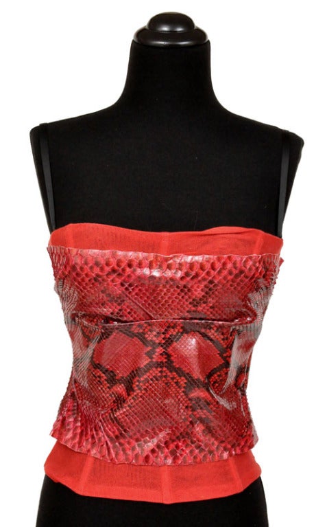 Stand out from the cocktail crowd in Dolce Gabbana 's striking snakeskin corset.

Genuine python skin
Inner lace bra
Size 42, runs small and would better fit US size 4

Excellent condition.