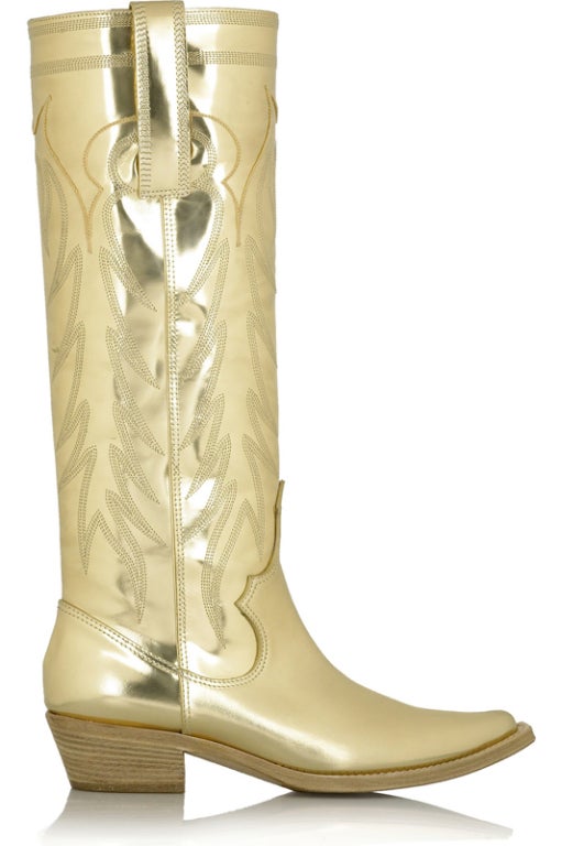 GIVENCHY BOOTS


Givenchy gives the classic cowboy boot the Midas touch with this gold leather knee-high pair. Wear them with denim or summer dresses for festival chic or in the city style. Heel measures approximately 50mm / 2 inches high with a