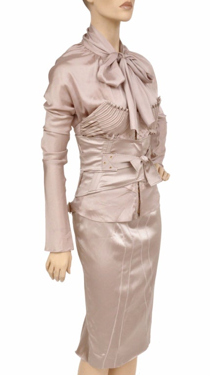 F/W 2003 Tom Ford for Gucci 

Silk suit with corset belt

Unique, Rare and Highly Collectible! 

Beautifully crafted and guaranteed to turn heads!

Three pieces: blouse, skirt, corset belt

Color: Nude

IT size 42

Very stretchy

Excellent condition