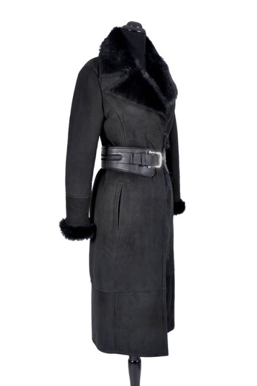 GUCCI  SHEARLING COAT

 Gucci's black sheepskin coat with a shearling collar is a luxurious coverup that will add glamour to any outfit. 

 Size 40, US 4-6 

 36-37 inches around the bust

the shoulders are 16 inches across the back

the