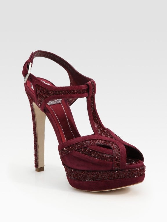 Simply divine, glitter-covered suede with intricate stitching, topped with a self-covered heel and buckle ankle strap.

Adjustable strap with buckle closure.
Approx. heel height: 5 3/4