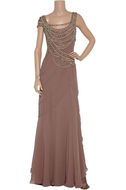 Channel retro glamour paired with modern sophistication in Alberta Ferretti's embellished silk gown. $7,115 

Alberta Ferretti gown: lilac silk, round neck with scalloped detail, cap shoulder at one shoulder, boned internal bodice, mesh