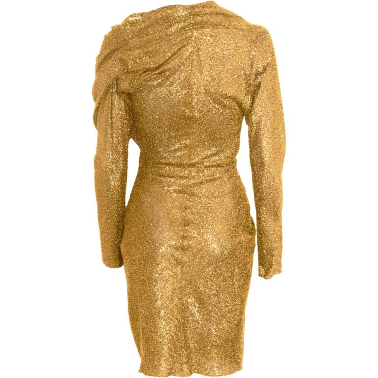 LANVIN
Gold Wrap Dress. A shorter version of Meryl's custom made gown that she wore for her Oscar nomination! 

Silk blend v-neck long sleeve wrap dress in gold lamé with shoulder pleating, gathered zip and clasp closure at hip and side slit. 45