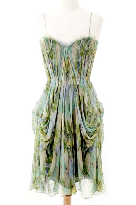 We think this 'Praying Mantis' corset dress is just one of the most gorgeous pieces from Mcquuen's S/S'10 'Plato's Atlantis' collection. In delicate frayed silk, with a subversively subtle green insect print, and elegantly draped skirt.

 The