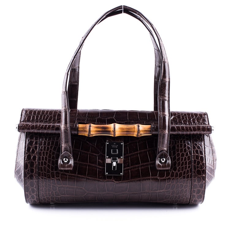S/S 2003 Collection

Iconic handbag designed by Tom Ford

Brown crocodile skin shoulder bag with silver-tone hardware, tonal top stitching, dual shoulder straps, bamboo ornamentation at front, internal zip wall pocket and logo flip lock closure