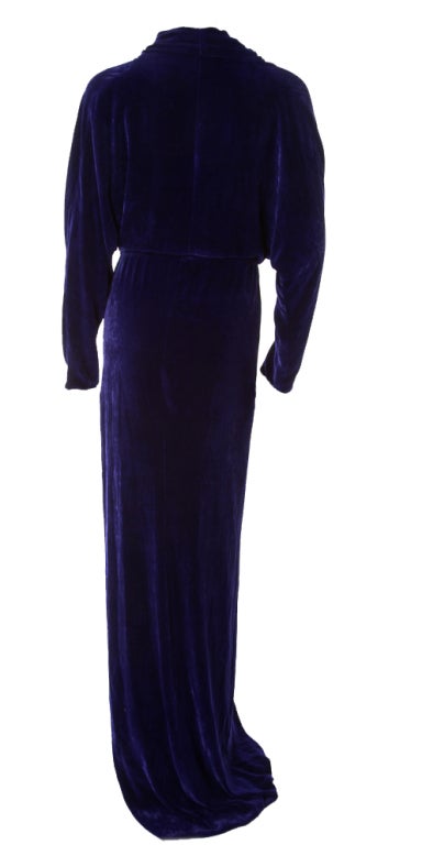 Lanvin channels Old Hollywood glamour with this plush velvet gown, crafted in a flattering wrap silhouette and detailed with dramatic sleeves. Play up the romanticism with a side-swept chignon and a vintage bracelet. 

Violet velvet. Wrap front