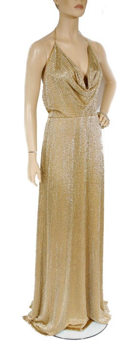 Make an elegant entrance in GUCCI' gold fully beaded gown. 

Size 38

Made in Italy

Fully lined

Excellent condition