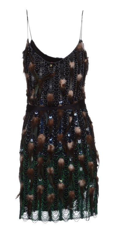 Matthew Williamson embellished dress has a bespoke look and feel.

Black tulle is hand beaded with black and green degradee glass beads and paillettes, and then finished with feathers and crystals.

UK Size 10

Fully lined

Brand new, with