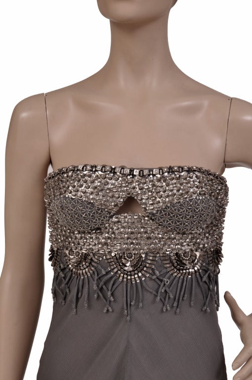 BRAND NEW VERSACE SWAROVSKI AND METAL EMBROIDERY DRESS

Strapless design, artfully embellished body  

and chiffon skirt  - ensure 

a stunning silhouette. 

Size  40 or US 4

Made in Italy

Retail price is $13,105.00