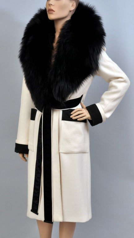 TOM FORD  WOOL COAT 

F/W 2011

Tom Ford's chalk white wool coat is the ultimate luxury for the fashion-forward. 

IT Size 38 -  US 2/4

Total length is 45 inches. Finished with genuine black fox fur collar, contrast trim and belt.

Guaranteed to
