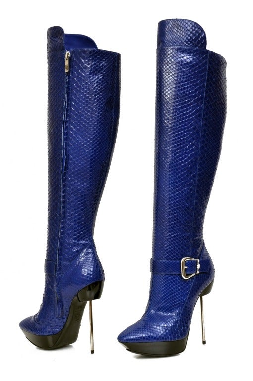 VERSACE

Platform boots

Heel measures approximately 130mm. 

 Versace boots have stiletto heel, python skin and pointed toe.

 
Size 36

Retail price is $2,875.00

Made in Italy

Brand new, display model. Shows minimal wear on one