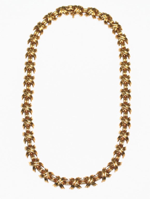 Designed by Tiffany, in 18karat yellow gold the necklace comprised of 35 X's each 3/8