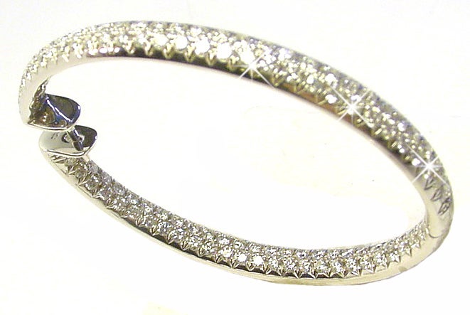 The very large oval 18Karat white gold hoops are set with 7.5 Carats of G-VS diamonds. They measure 2