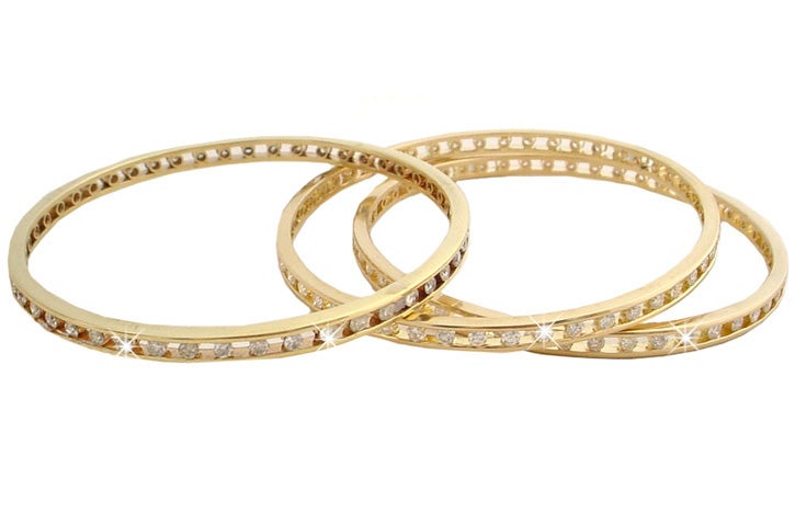 You'll love the look of 3 diamond bangle. Each is 18karat yellow gold bezel se with 48 fully faceted round G-V diamonds. Each bracelet has 2.4 Carats and weighs 10.2 Grams. They measure 2 5/16