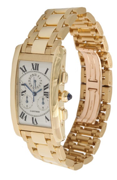 This large 18Karat yellow gold Cartier Chrono measures 45mm x 26mm and weighs 157 Grams. The Cartier quartz movement is Chrono Reflex and displays date - hours - minutes and seconds. The sapphire crystal is scratch resistant and is water resistant
