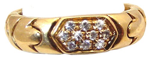 This classic ring from the ALVEARE colletion is 18Karat yellow gold set with 10 G VS full cut round diamonds totaling about .40 Carats. The band is 3/8