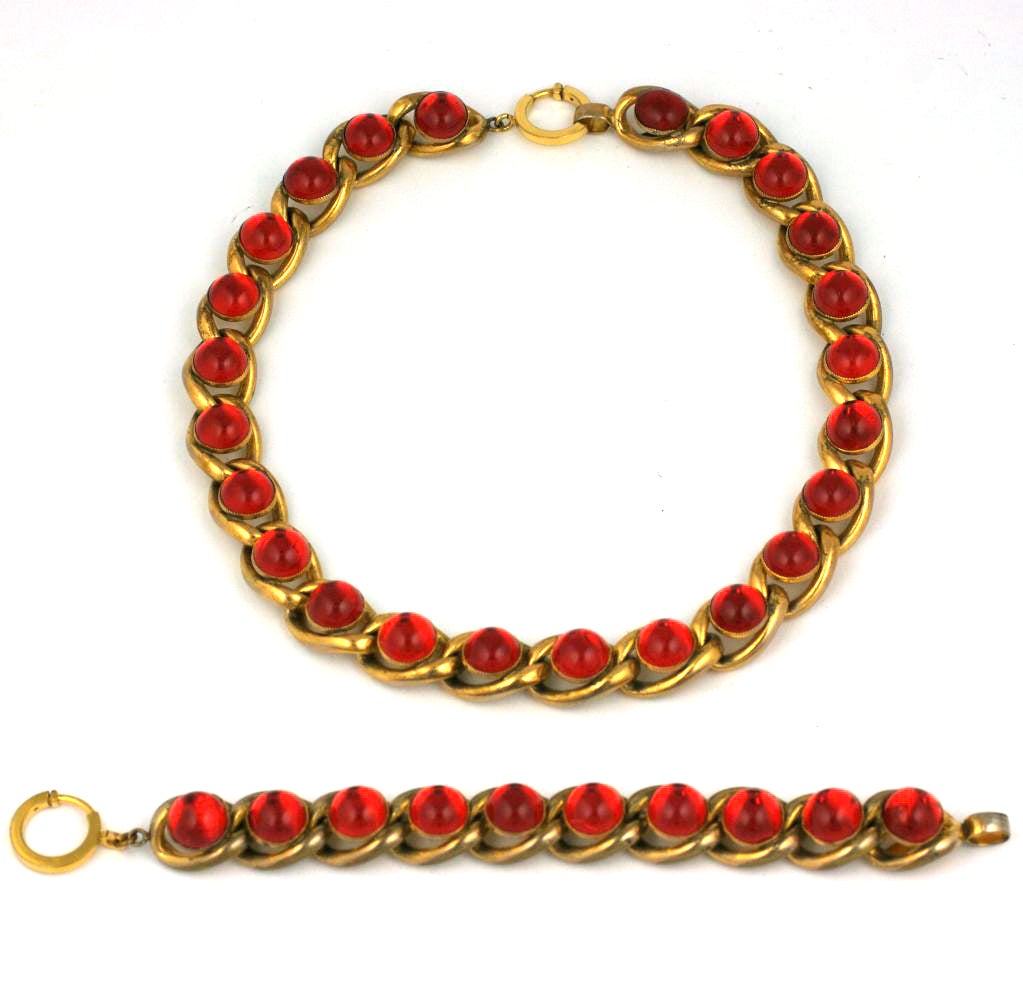 Schiaparelli Haute Couture Deco style necklace from the early 1940s with gilt curb links set with faux cabochon rubies. These strong architectural motifs emerged in the mid 1930's and continued until the advent of the war when she came to the