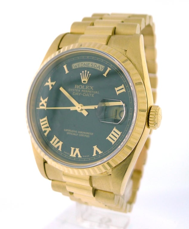 BRAND NAME: 	  	Rolex
STYLE NUMBER: 	  	18238
ALSO CALLED: 	  	President
SERIES: 	  	Day-Date President
STYLE (GENDER): 	  	Men's
CASE MATERIAL: 	  	18K Yellow Gold
DIAL COLOR: 	  	Black Roman Pyramid Dial
MOVEMENT: 	  	Automatic
FUNCTIONS: