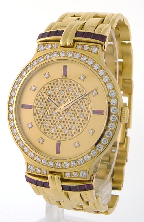 BRAND NAME: 	  	Patek Philippe
REF. NUMBER: 	  	3964-12
SERIES: 	  	Jewelry
CASE MATERIAL: 	  	Yellow Gold w/ Rubies & Diamonds
DIAL COLOR: 	  	Champagne w/ Pave Diamond 