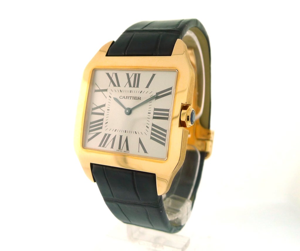 BRAND NAME: 	  	Cartier
STYLE NUMBER: 	  	W2006951
SERIES: 	  	Santos Dumont
STYLE (GENDER): 	  	Men's
CASE MATERIAL: 	  	Rose Gold
DIAL COLOR: 	  	Rhodium Plated w/ Roman Numerals
MOVEMENT: 	  	Mechanical
FUNCTIONS: 	  	Hour,