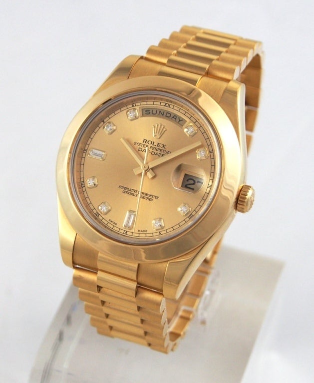 Brand Name: Rolex
Style Number: 218238
Also Called: President II
Series: Day Date II
Gender: Men's
Case Material: 18K Yellow Gold
Dial Color: Champagne with Diamonds
Movement: Automatic
Functions: Hours, minutes, seconds, date
Crystal
